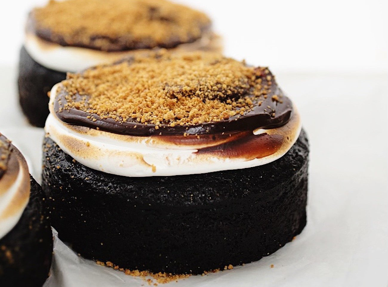 Dark chocolate cupcakes with marshmallow fluff and ganache