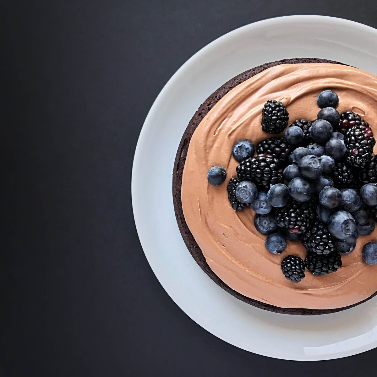 Dark chocolate flourless cake with dark chocolate whipped ganache