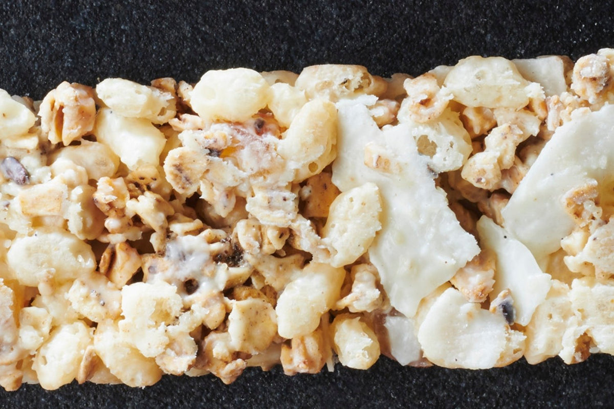 Exotic cereal bars with dried mango, coconut shavings, and white chocolate