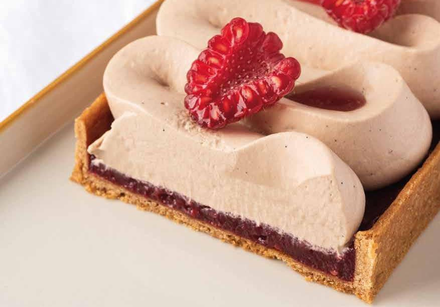 Milk chocolate tart with vanilla ganache and fresh raspberry compote