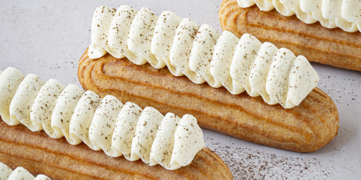 Vanilla eclairs with vanilla pastry cream and vanilla whipped ganache ready to be served