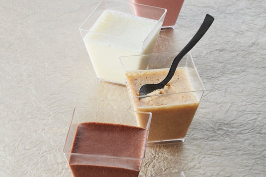 Five elegant verrines of airy mousses: dark chocolate, creamy milk, delicate white, caramelized blond Dulcey, and fruity Strawberry Inspiration