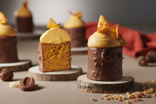 Carrot cake with Valrhona whipped ganache, chocolate coating, and carrot wafer