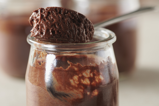 Dark Chocolate Mousse with Guanaja 70% in a glass with a spoon