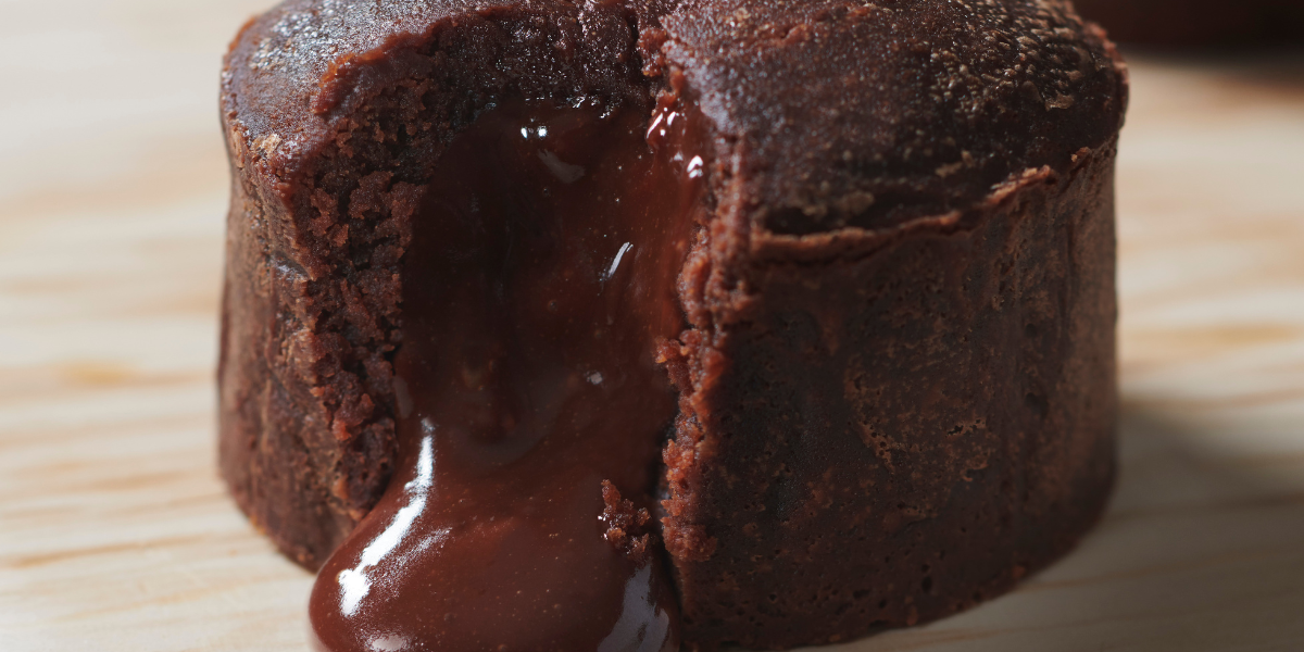 Dark chocolate lava cake with a zoom on the melting dark chocolate center