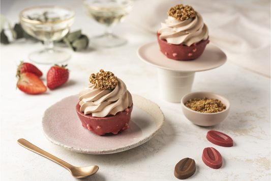 Milk chocolate, strawberry Inspiration and hazelnut shortcake placed on a plate with a spoon, Azelia beans and strawberry pieces