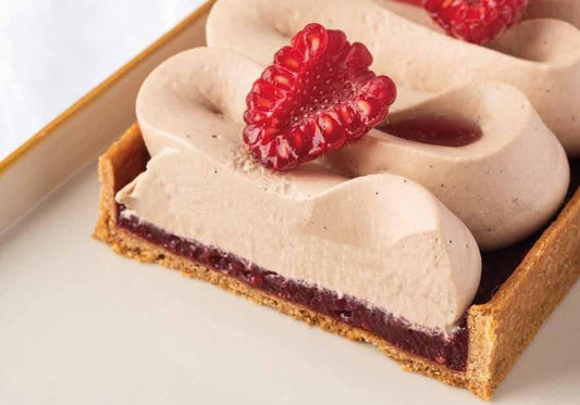 Milk chocolate tart with vanilla ganache and fresh raspberry compote