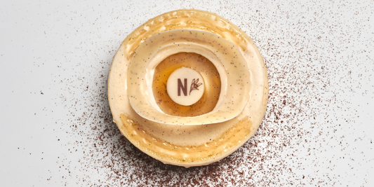 Vanilla entremets with white chocolate mousse and pineapple compote ready to be served