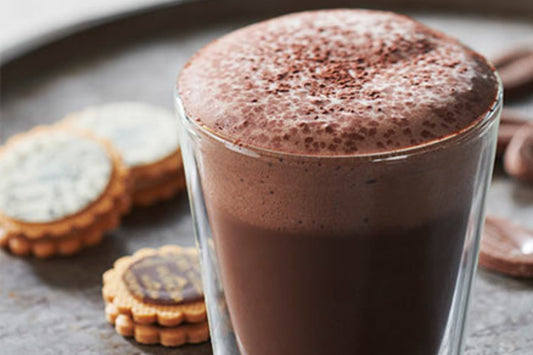 Dark chocolate mocha beverage in a mug ready to be served with cookies