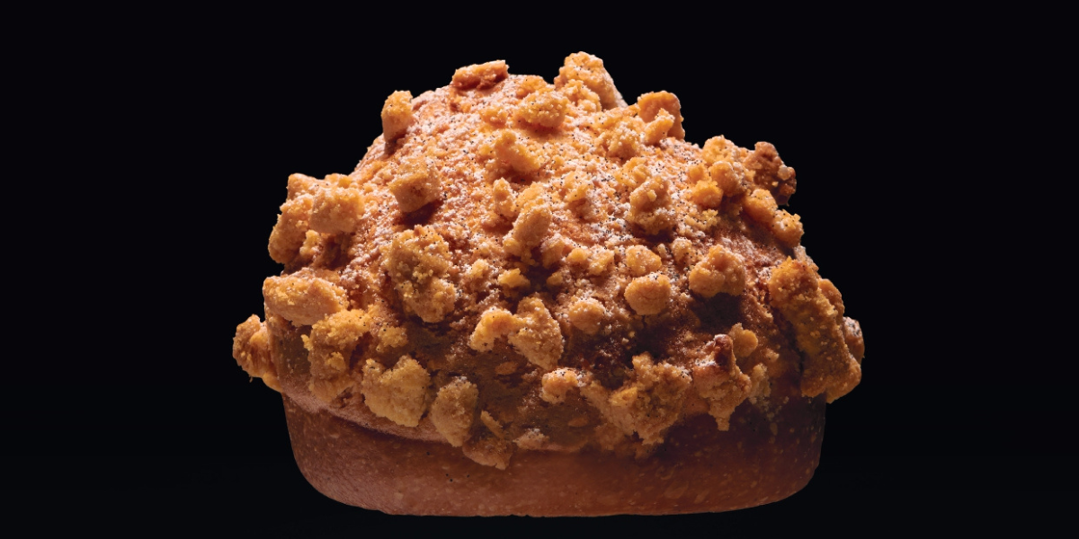 Vanilla and rum brioches with almond macaroon and streusel on a dark background