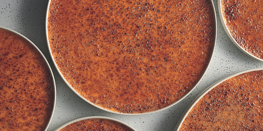 Vanilla cremes brulees ready to be served in individual plates