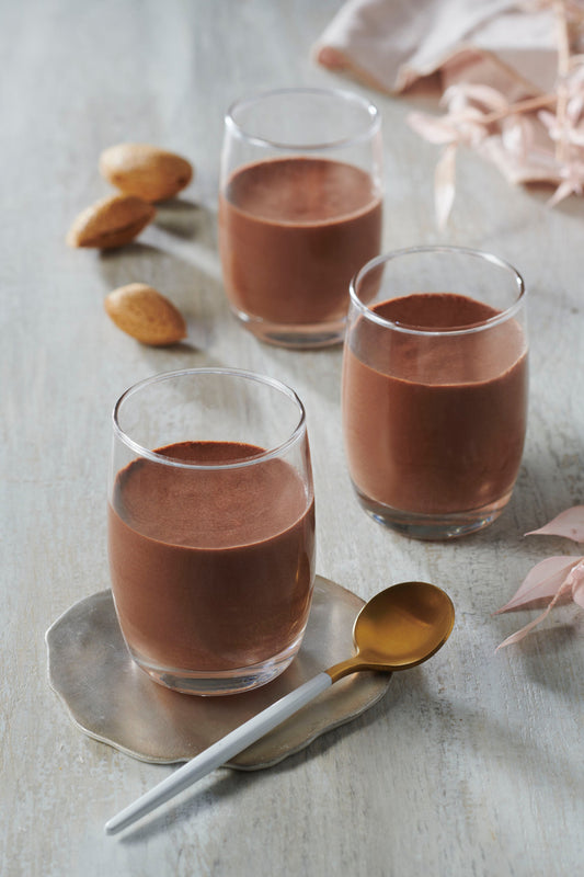 Very Dark Chocolate Mousses in glasses with a spoon