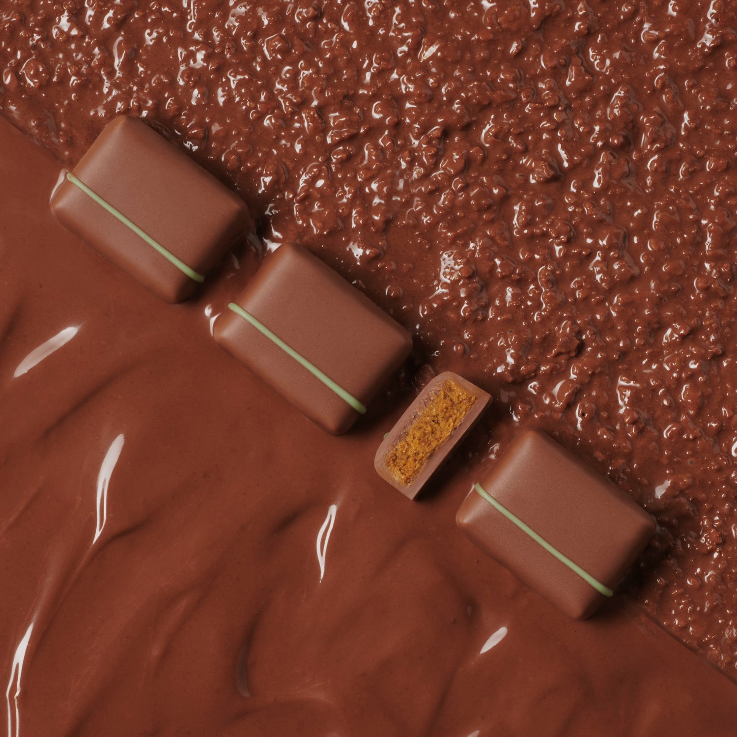 Chocolate candies with a textured chocolate background